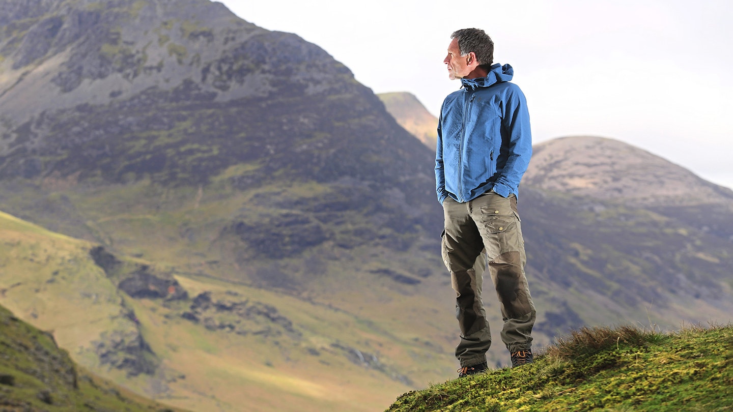 Man wearing Black Diamond Storm Coefficient fleece jacket on a mountainside