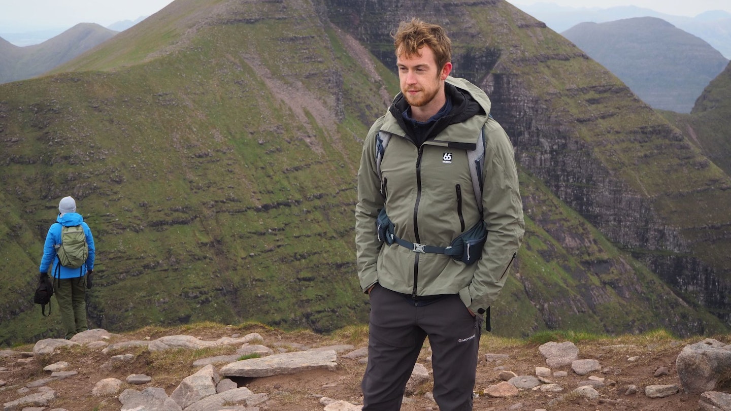 Hiker in Scottish Highlands wearing 66°North Snaefell jacket