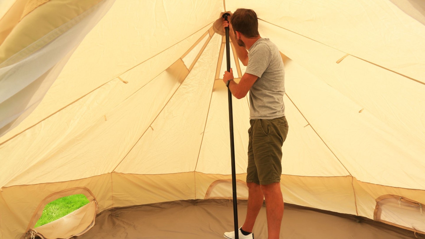 Oli adjusts the central pole in the roundhouse