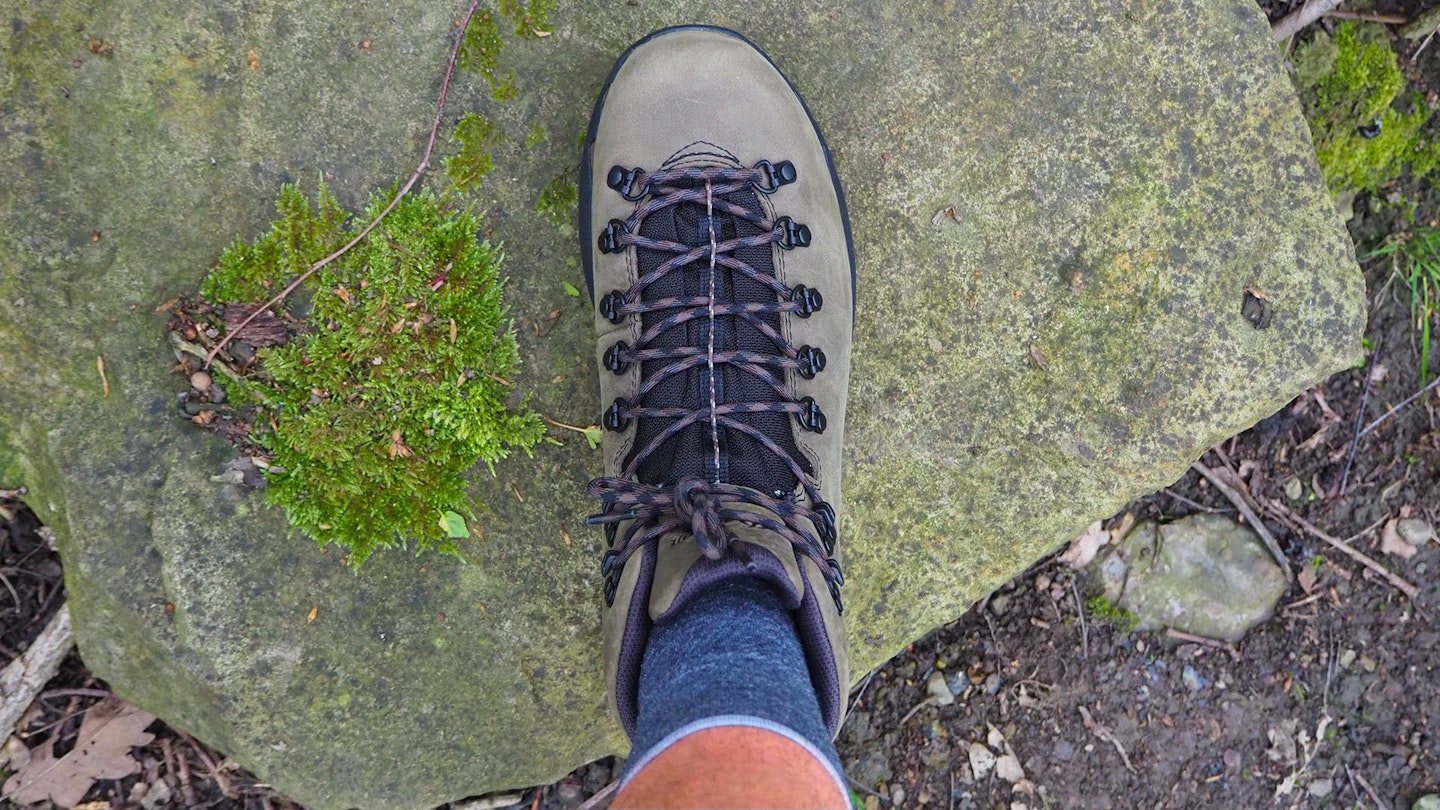 Bird's eye view looking down on hiker's foot wearing Danner Mountain 600 EVO