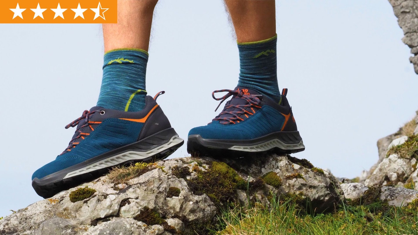 Closeup of hiker standing on a rock wearing Hanwag Blueridge Low ES shoes