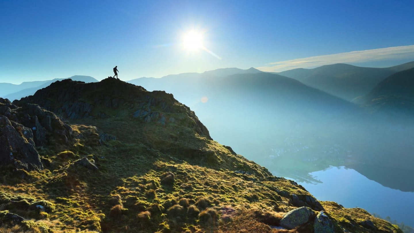 Hiker on Place Fell looking over Ullswater Lake District