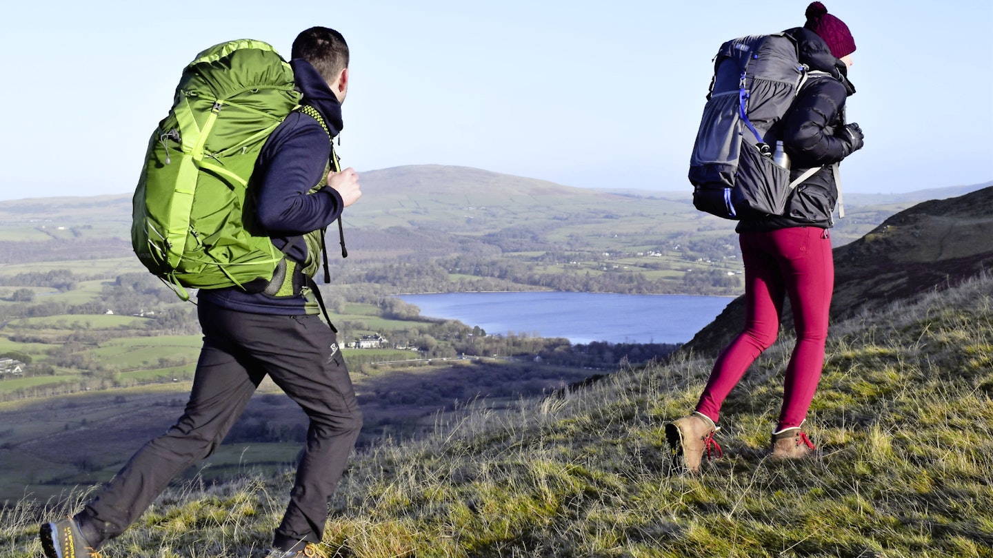 Two hikers backpacking in English countryside