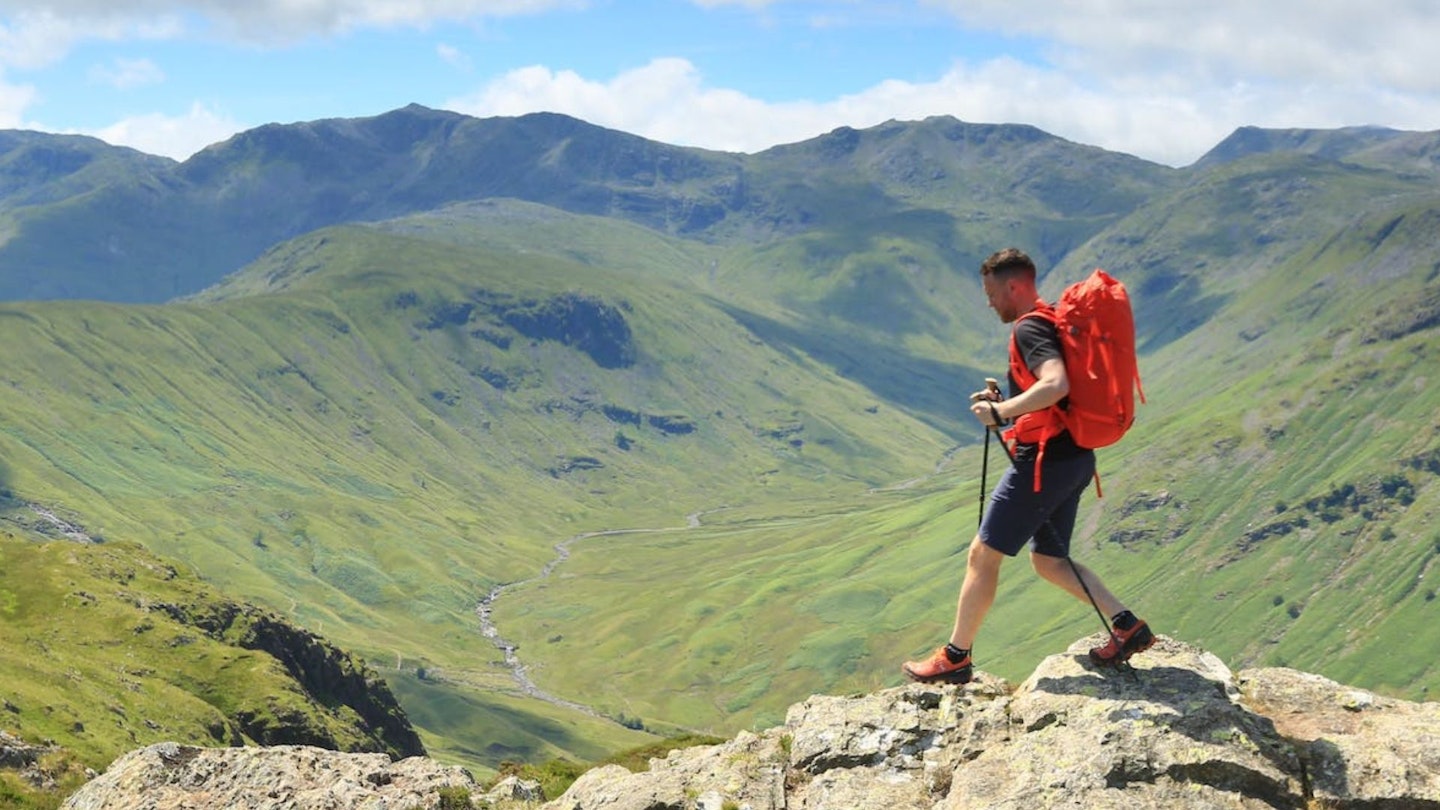 LFTO tester James Forrest walking across rocks wearing hiking shoes