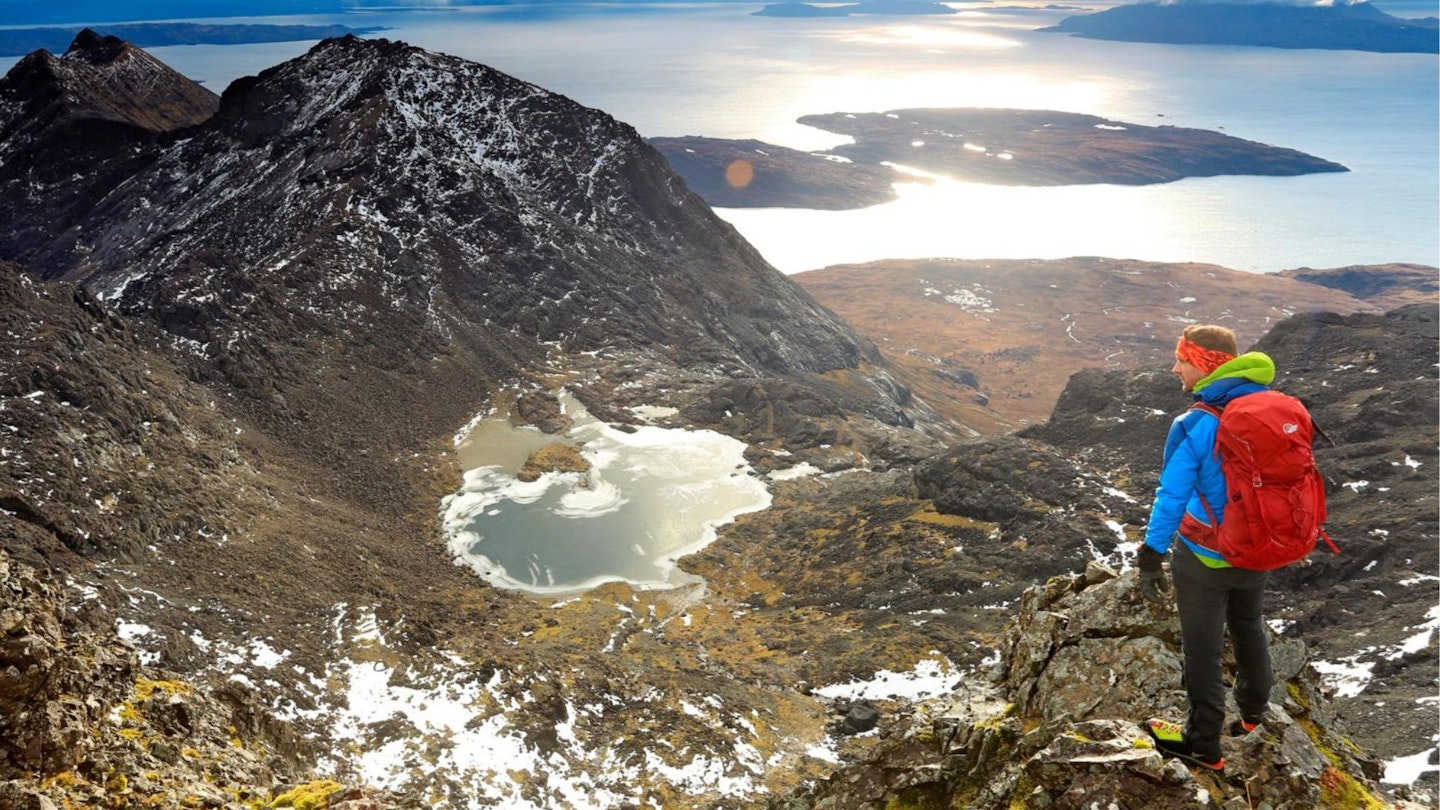 Hiker wearing Lowe Alpine backpack Isle of Skye