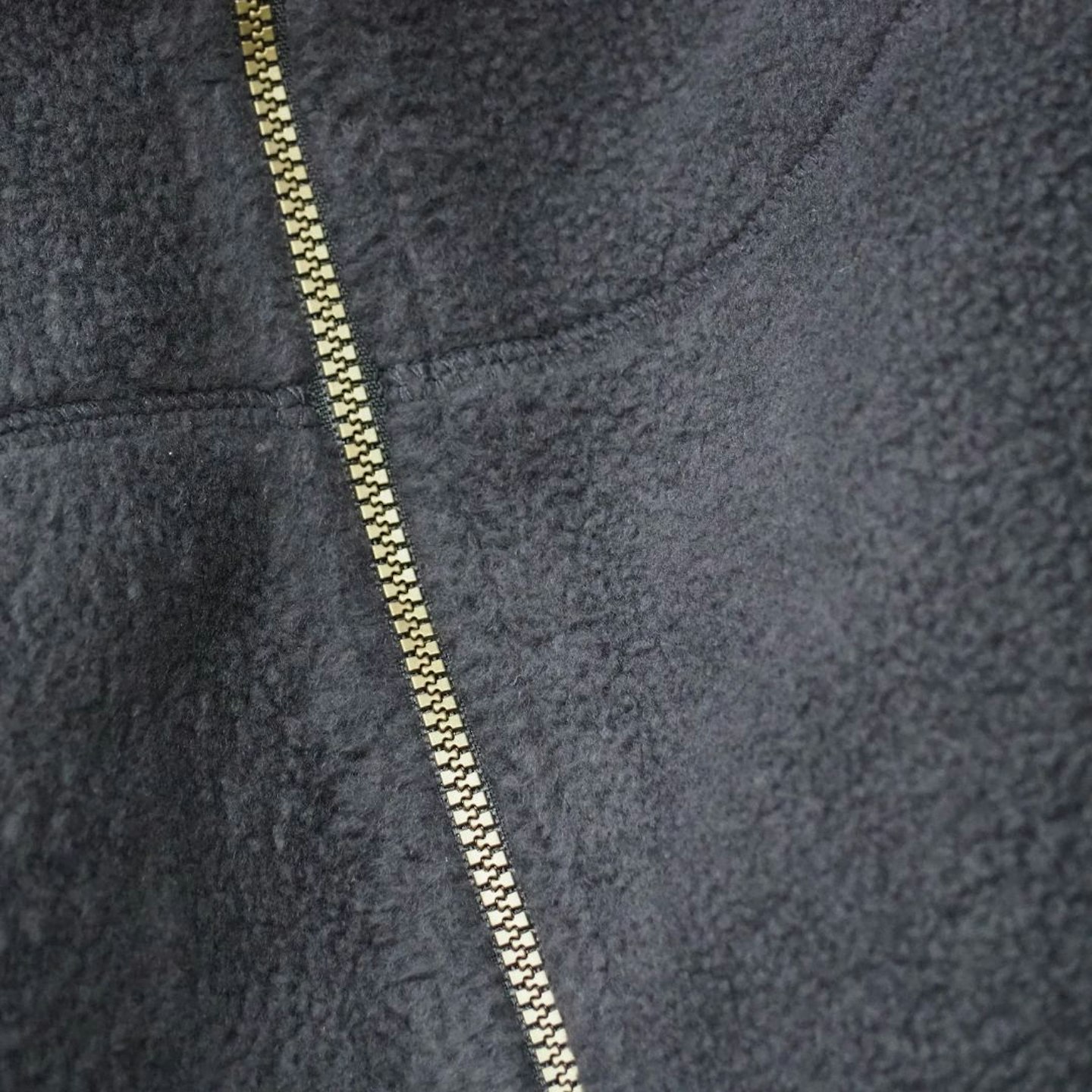 Closeup of Sherpa Sanani Eco Fleece Jacket zip and fabric