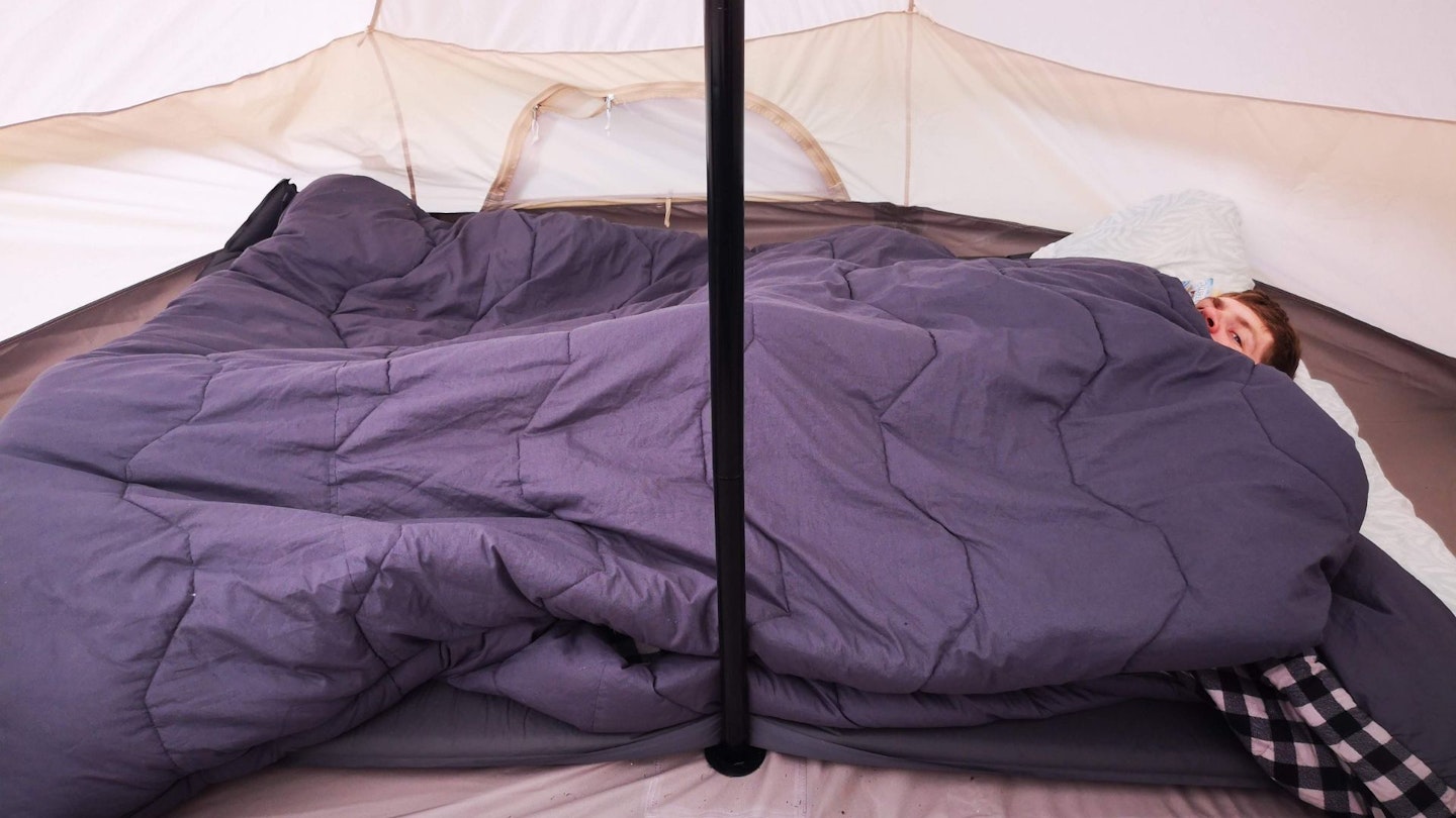 The double air mattress squished against the pole